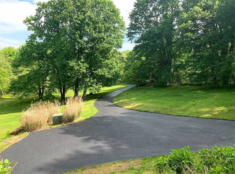 Freshly paved residential asphalt driveway
