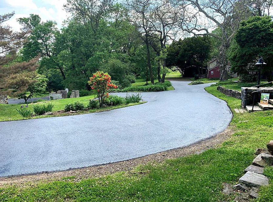 Asphalt sealcoating application on a driveway