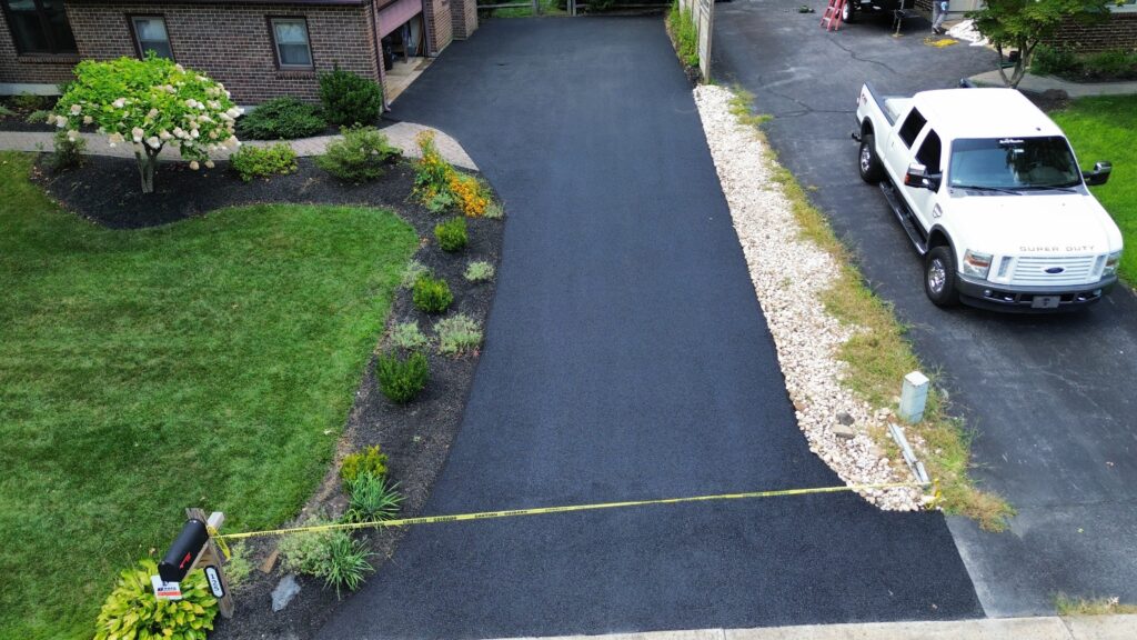 Freshly paved residential asphalt driveway