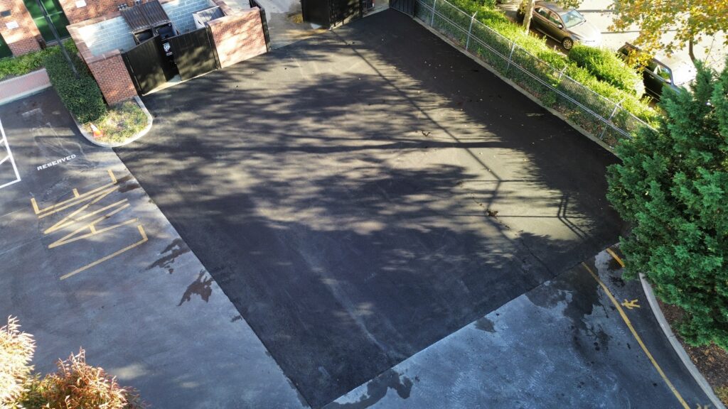 Freshly paved commercial asphalt parking area