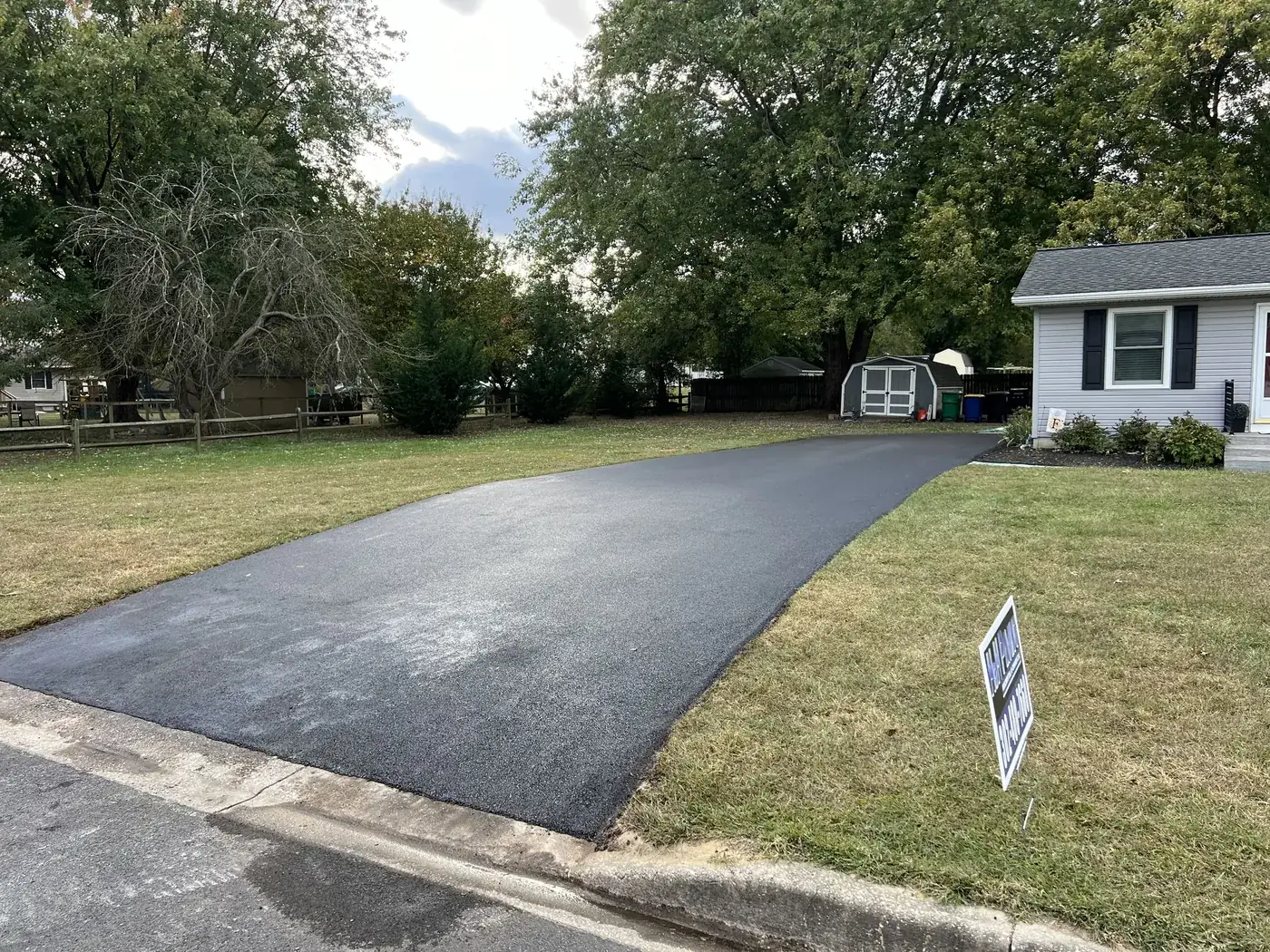 Finished driveway with H&H yard sign